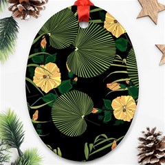 Tropical Vintage Yellow Hibiscus Floral Green Leaves Seamless Pattern Black Background  Ornament (oval) by Sobalvarro